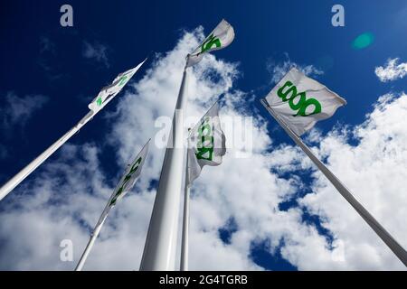Umea, Norrland Sweden - June 7, 2021: flags outside grocery store with the name of the store Stock Photo