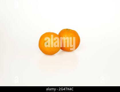 two ripe tangerines on a white background Stock Photo