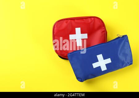 First aid medical kits on yellow background Stock Photo
