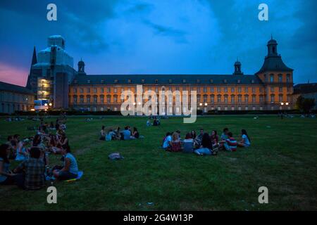 BONN, GERMANY - JULY 22: Students of University in Bonn sit in front of main building of University on July 22, 2013 in Bonn, Germany. University Bonn Stock Photo