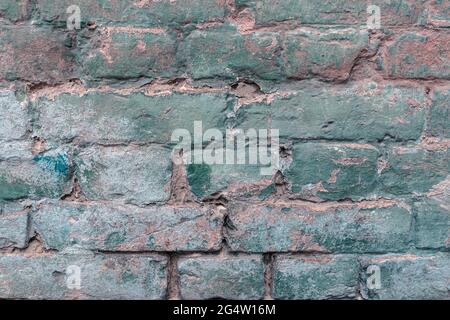 Old authentic brick wall cracks and collapses Stock Photo