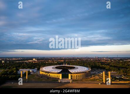 Berlin, Germany. 23rd June, 2021. Football: European Championship, preliminary round, Group E, Germany - Hungary. The setting sun shines on the Olympic Stadium in Berlin. Credit: Christophe Gateau/dpa/Alamy Live News Stock Photo