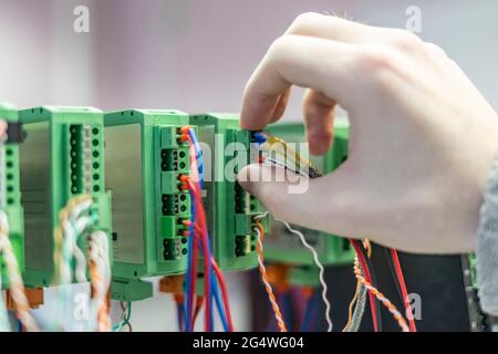 bunch of wires inserted in elctric controller Stock Photo