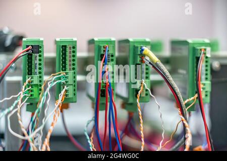 bunch of wires inserted in elctric controller Stock Photo