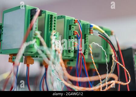 bunch of wires inserted in elctric controller Stock Photo