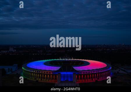 Berlin, Germany. 23rd June, 2021. Football: European Championship, Germany - Hungary, preliminary round, Group F, match day 3: The Olympic Stadium in Berlin is lit up in rainbow colours during the match. Credit: Christophe Gateau/dpa/Alamy Live News Stock Photo