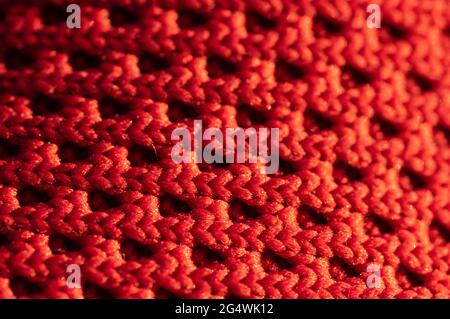 A close-up pattern of a woven red fabric Stock Photo