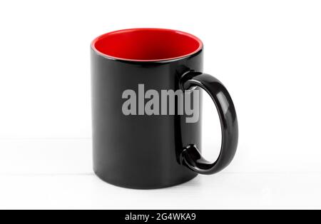 Blank black cup with red isolated on white background Stock Photo