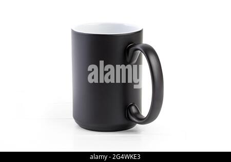 Black ceramic cup with white inside on a white background Stock Photo