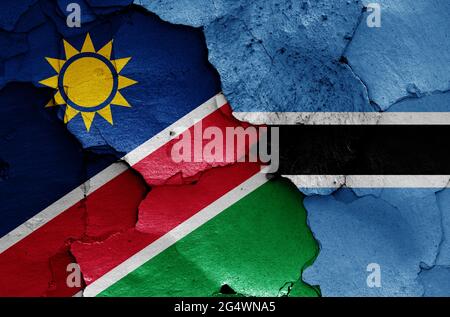 flags of Namibia and Botswana painted on cracked wall Stock Photo