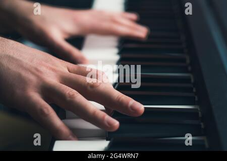 Man playing piano close up Stock Photo