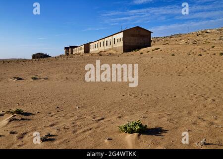 Ghost town Kolmanskop in Namib desert near Lüderitz: buildings in former mining town, Sperrgebiet National Park, Karas Region, Namibia Stock Photo