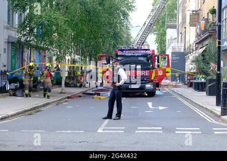 The emergency services attend the scene of a fire at the Lore of the Land pub in Fitzrovia, owned by film director Guy Ritchie. Stock Photo