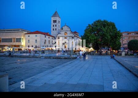 Croatia, Zadar County, Zadar, Town square in front of Saint Marys Church at dusk Stock Photo