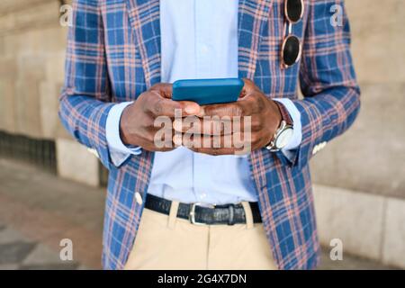 Male entrepreneur using smart phone Stock Photo