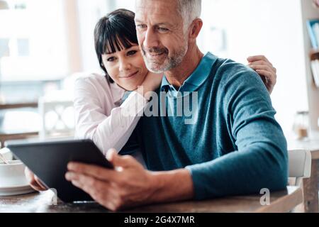 Business couple using digital tablet at cafe Stock Photo