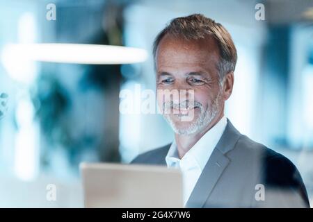 Senior businessman using digital tablet in office Stock Photo