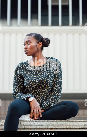 Thoughtful mid adult woman looking away Stock Photo