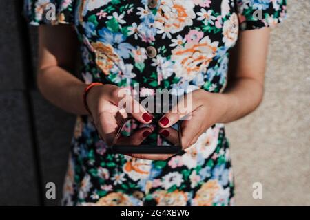 Young woman holding smart phone Stock Photo