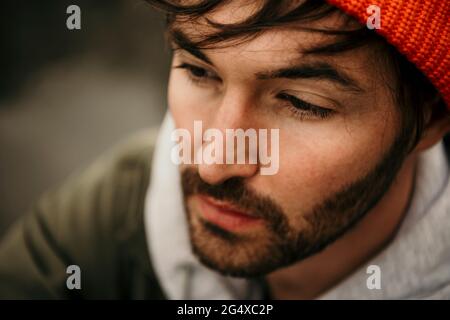 Thoughtful bearded man looking away Stock Photo