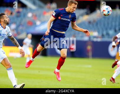 Chicago, USA. 23rd June, 2021. Major League Soccer (MLS) Chicago Fire FC Robert Beric (27) heads the ball against FC Cincinnati at Soldier Field in Chicago, IL, USA. Cincinnati won 1-0. Credit: Tony Gadomski/All Sport Imaging/Alamy Live News Stock Photo