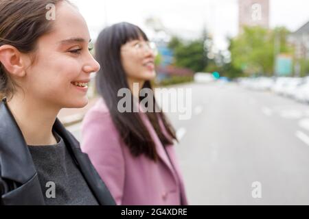 Smiling colleagues leaving together after work Stock Photo