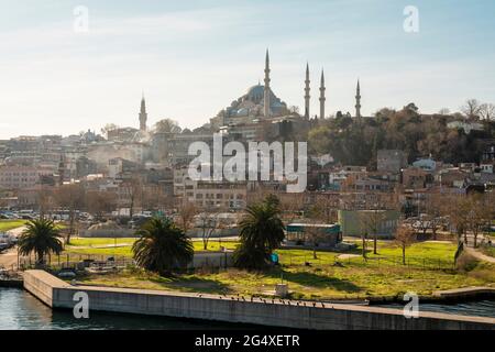 Turkey, Istanbul, Waterfront park with Rustem Pasha and Suleymaniye mosques in background Stock Photo