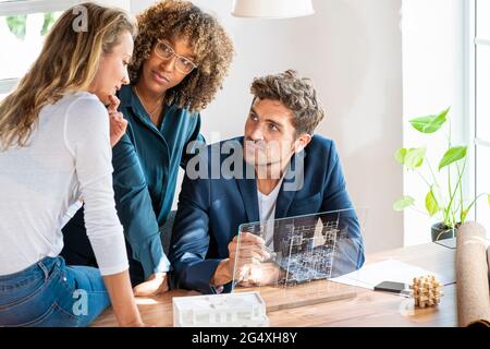 Professional team with futuristic digital tablet working at office Stock Photo