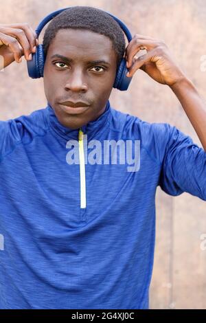 Handsome man wearing wireless headphones Stock Photo