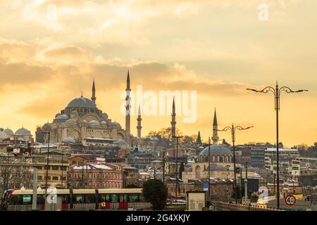 Turkey, Istanbul, Moody sky over Fatih district at sunset with Suleymaniye and Rustem Pasha mosques in background Stock Photo