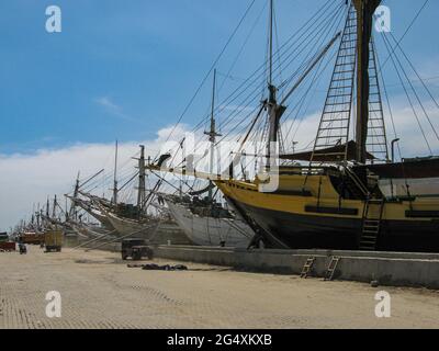 Jakarta, Indonesia - July 13, 2009: wooden sailing boats in an old harbour waiting for loading or unloading Stock Photo