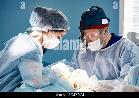 View of the modern operating room during surgical procedure Stock Photo ...