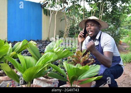 an african farmer making a phone call Stock Photo