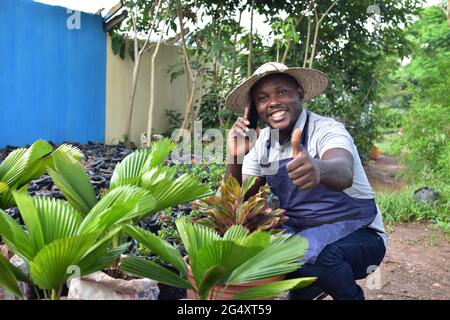 an african farmer making a phone call Stock Photo