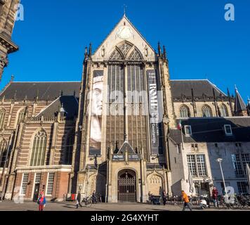 AMSTERDAM - OCTOBER 2: Tourists in front of the Nieuwe kerk (New church) located on Dam square. The building is used for exhibition space and as museu Stock Photo