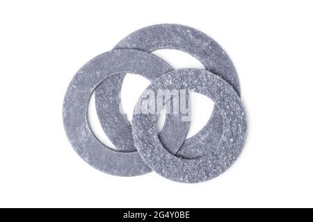 Paronite gaskets for flange connections of pipes of various sizes Stock Photo