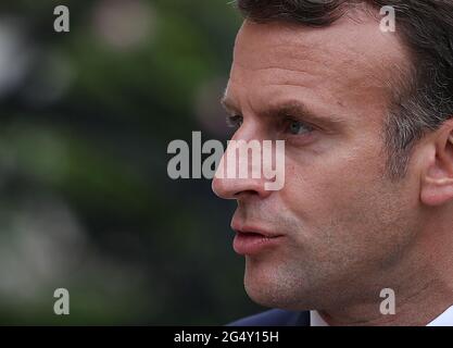 Paris, France. 23rd June, 2021. French President Emmanuel Macron attends a press conference at the Elysee Palace in Paris June 23, 2021. European Commission President Ursula von der Leyen on Wednesday ended the first leg of her visit to 12 EU members that had their national recovery plans approved. In Paris, Ursula von der Leyen announced that France will receive 39.4 billion euros in grants. Credit: Gao Jing/Xinhua/Alamy Live News Stock Photo