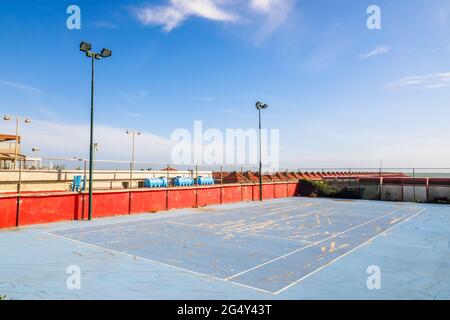 Damaged tennis field in a beach resort in Ostia Lido - Rome, Italy Stock Photo