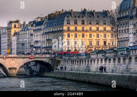 Paris, France - March 2, 2021: Typical Haussmann buildings along Seine river in Paris Stock Photo