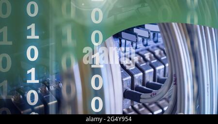 Binary coding data processing over close up of computer server against green technology background Stock Photo