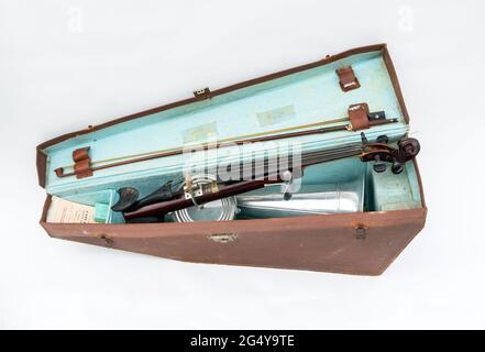 A Stroh violin or phonofiddle or stroviol musical recording instrument with bow and case on a white studio background Stock Photo