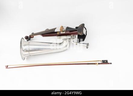 A Stroh violin or phonofiddle or stroviol musical recording instrument with a bow on a white studio background Stock Photo