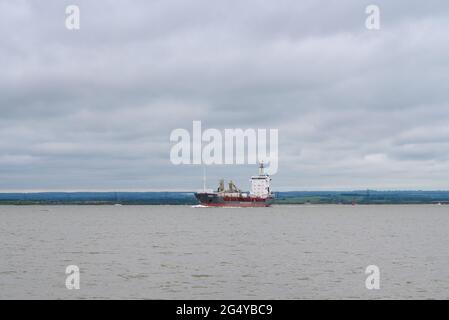 'Cemisle' cement carrier ship, operated by Baltrader, passing Isle of Sheppey on river Medway in the Thames estuary, Kent, England. Stock Photo