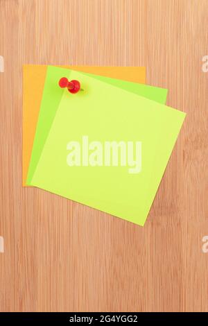 Colored Sticky Notes with Copyspace Pinned to the Wooden Message Board. To Do List Reminder in Office. Blank Memo Sticker at Work - Template. Empty Checklist - Mockup Stock Photo