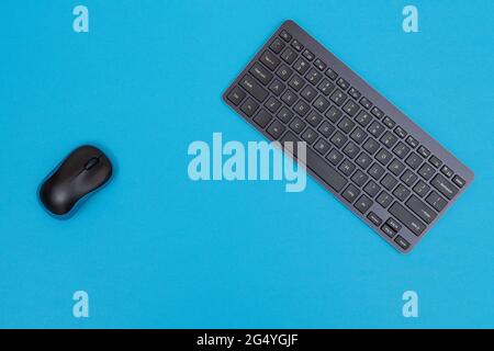 Office Workplace with Digital Gadgets Lying on Blue Table - Flat Lay Stock Photo