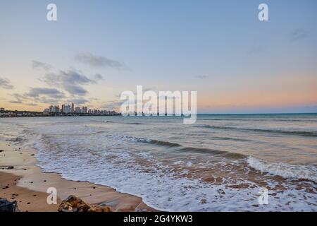 João Pessoa view from beach at sunset and waves coming in Paraíba, Brazil Stock Photo