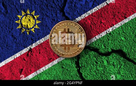 Bitcoin crypto currency coin with cracked Namibia flag. Crypto restrictions Stock Photo