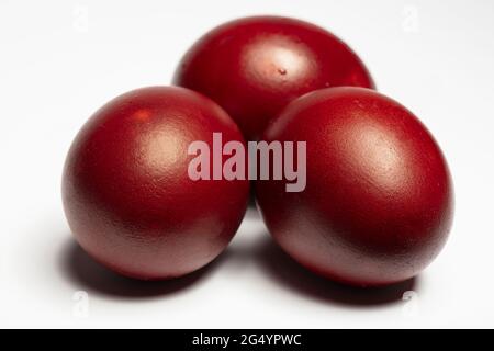 Classic easter eggs painted with onion peel close-up on a white background Stock Photo