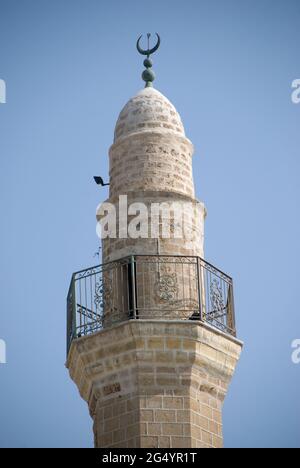TEL AVIV, ISRAEL - May 24, 2021: Tower and minaret of Mosque in Jaffa, old town of Tel Aviv - Israel Stock Photo