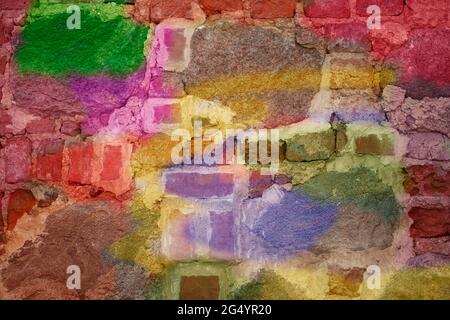 Brick wall with multi-colored paint close-up. Background brick creative. Stock Photo